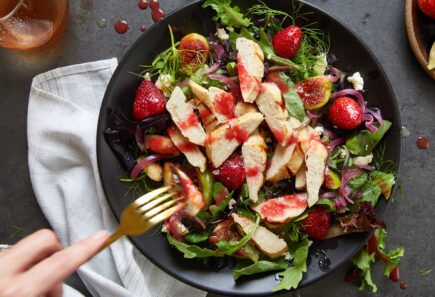 Cultivated chicken cut on a salad from above