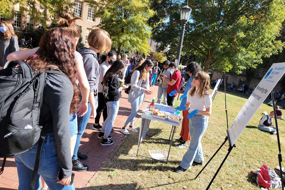 Students doing a plant based meat taste test outside on campus