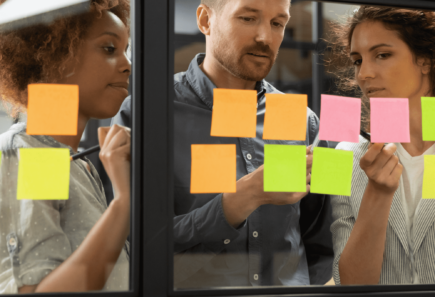 A photo of three people working